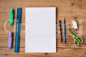 All you need is right in front of you. High angle shot of stationery on a wooden table.