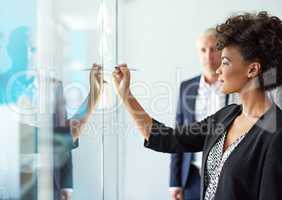 Successful professionals plan ahead. Shot of a group of colleagues having a brainstorming session at work.