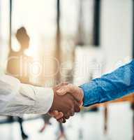 Aspiring to greatness together. Closeup shot of businesspeople shaking hands in a office.