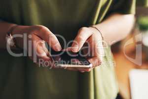 The best notifications come from new clients. Shot of an unrecognisable woman using a smartphone while working from home.