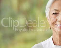 Portrait of one happy senior caucasian woman with copyspace. Face of carefree cheerful retired female smiling at the camera. Carefree, relaxed and wise old woman optimistic about life and aging