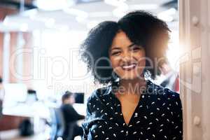 Happy days at work. Portrait of an attractive young female designer smiling and in good spirits at the office.