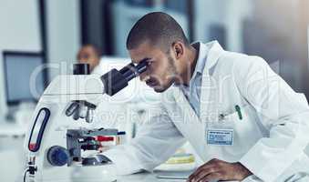 Success never rests, neither do diseases. Cropped shot of a young male scientist working in his lab.