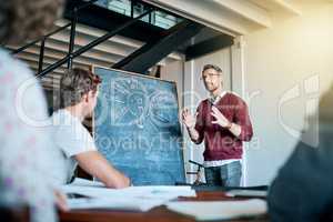 Creative office days. Shot of a creative business team having a meeting and discussing business related issues in the office.