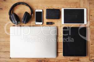 You wont understand, Its a technology thing. High angle shot of wireless technology on a wooden table.