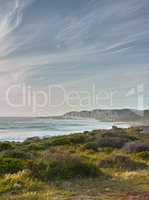 A view over the ocean in Cape Province, South Africa. Beauty in nature with the seascape of the ocean. Sky with clouds over the ocean on a summers day. Calm and serene nature scene with waves