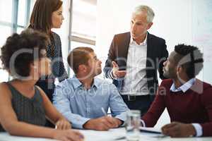 They rely on their ability to function as a team. Cropped shot of corporate businesspeople in the boardroom.