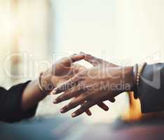 You meet tons new people out in the city. Closeup shot of two businesswomen shaking hands in the city.