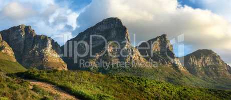 Landscape view of mountains in Hout Bay in Cape Town, South Africa during summer holiday and vacation. Scenic hills, scenery of fresh green flora growing in remote area. Exploring nature and the wild