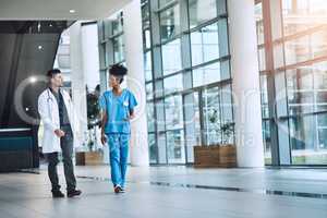 Are you ready for this procedure. Shot of medical practitioners having a conversation in a hospital.