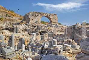 Ancient city ruins of Ephesus in Turkey during the day. Traveling abroad and overseas for holiday, vacation, tourism. Excavated remains of historical building stone from Turkish history and culture