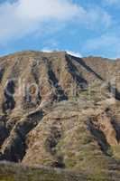 The Koko Head Volcano in Oahu, Hawaii. An extinct volcano crater up a mountain in summer. A beautiful view of a sightseeing location or landmark outdoors. A natural vacation destination for tourism