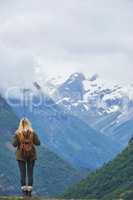 Travel adventure woman enjoying view of majestic glacial valley on exploration discover beautiful earth