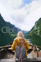 Adventure woman enjoying majestic river view from row boat epic landscape travel discover explore beautiful earth