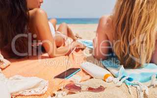 Carefree Travel happy friends tanning paradise beach for destination lifestyle vacation sunscreen smart phone sunglasses