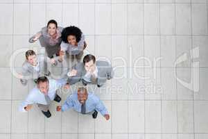 The only way is up with this team. Top view of a triumphant business team looking up at you - Copyspace.