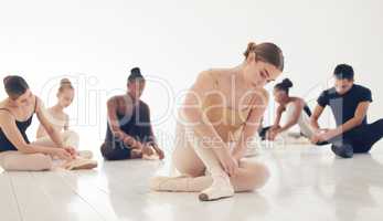 The body says what words cannot. a group of young ballerinas preparing for their routine.