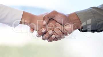 I agree with you. Closeup shot of two unrecognisable businesspeople shaking hands in an office.