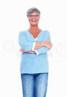 Happy mature woman. Happy mature woman smiling over white background with hands folded.