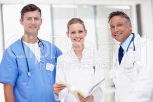 Their patients interests are top priority. Portrait of three medical professionals standing together and smiling.