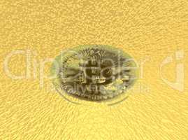 Even the financial world is becoming digital. Conceptual image of a single bitcoin against a yellow background.