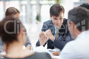 Theres just a few areas Id like to address. A young businessman addressing his colleagues during a meeting.