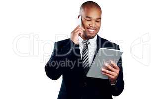 Todays schedule success, success, success. Studio shot of a handsome young businessman on a call and using a tablet against a white background.