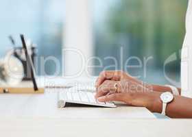 I have some information you might be interested in. Cropped shot of a businesswoman typing on her keyboard.