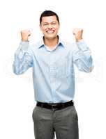 The successes of your hard work. Shot of an asian businessman celebrating against a studio background.