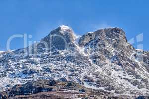 Scenic panoramic of snow capped mountain landscape in Bodo, Nordland, Norway against a clear blue sky background. Breathtaking and picturesque view of a cold and icy natural environment in winter