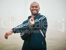 I always warm up. Cropped portrait of a handsome young male athlete warming up outside.