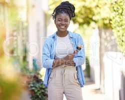 Start by doing whats necessary. Cropped shot of a woman holding a paintbrush.