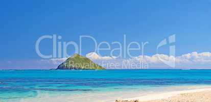 Lanikai Beach is located in Lanikai, meaning heavenly sea in Hawaiian is a neighborhood within Kailua, on the windward coast of Oahu, Hawaii. This small 12 mile beach has been consistently ranked among the best beaches in the world.