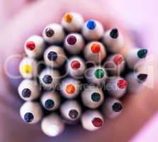 Closeup of a pile of colour pencils. Macro shot of a collection of pencil crayons for arts, crafts and creative use. Stationery supplies for school or office. Colourful pencils with sharpened nibs to draw with