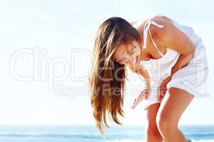 Happy young girl enjoying on the beach. Portrait of a happy young girl enjoying on the se shore - Outdoor.