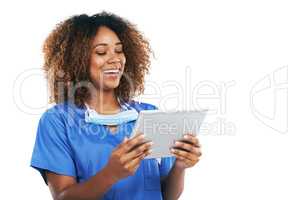 Technology has become such a vital for her. Studio shot of an attractive young nurse using a digital tablet against a white background.