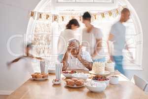 All great and precious things are lonely. Shot of a senior man looking lonely while celebrating his birthday alone at home.