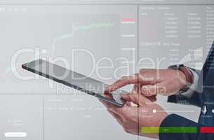 Making the best trades. Closeup shot of an unrecognisable businessman using a digital tablet while superimposed over a stock market infographic.