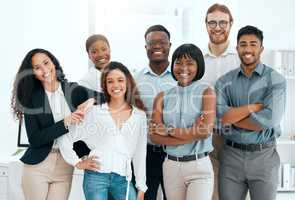 Have you met a better team. a group of businesspeople standing in an office at work.