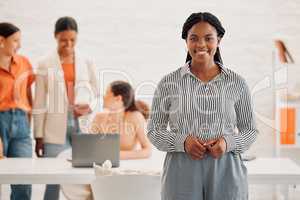 Young happy african american businesswoman standing in an office at work. Confident black female businessperson in a meeting at work