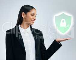 The individual investor should act consistently as an investor. a confident young businesswoman pointing against a grey studio background.