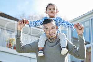 I love my daughter to the moon and back. Shot of a young man carrying his daughter on his shoulders.