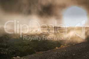 Largest volcano in Mauna Loa with copy space. Landscape of misty mountain on Big Island, Hawaii. View of Mauna Kea, dormant volcano in a secluded area. Foggy sky near summit of volcanic land at sunset