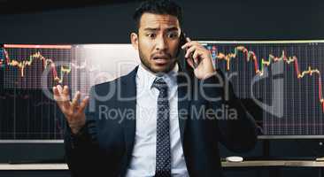 Pain is temporary. Quitting lasts forever. a young businessman making a phone call in order to monitor the stock market.
