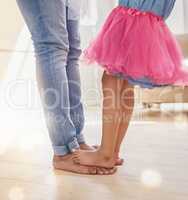 We all grow in different directions, but our roots remain. Shot of a father dancing with his daughter.