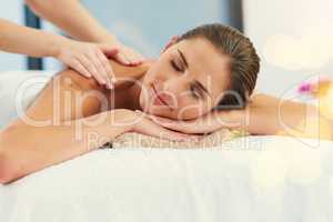 I can deal with the drama after this. a beautiful young woman lying on a massage table at the day spa.