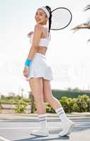I only ever look back to see how far Ive come. Full length shot of an attractive young tennis player standing alone on the court during practice.