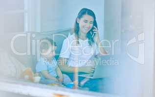 He just wants to be involved. High angle shot of an attractive young woman working on her laptop while looking after her baby boy.