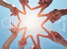 You shine as bright as a star. a group of unrecognizable people making a star shape with their fingers.
