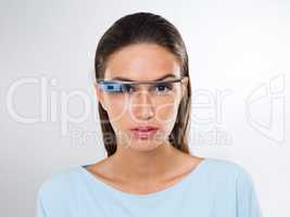 an attractive young woman wearing glasses with internet access.The commercial product(s) or designs displayed in this image represent simulations of a real product, and are changed or altered enough so that they are free of any copyright infringements. Ou